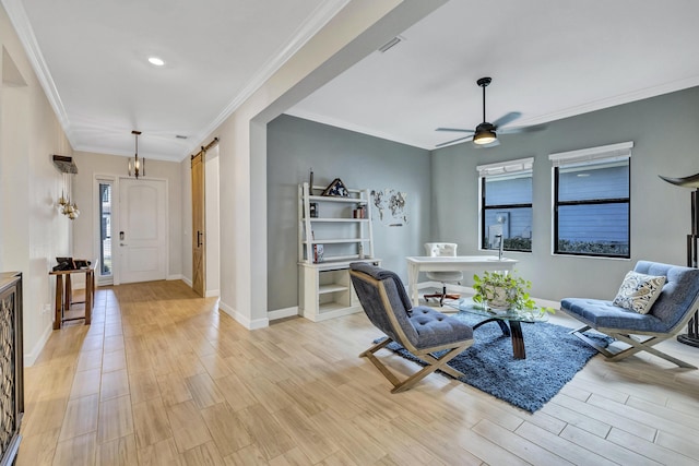 living room featuring crown molding, ceiling fan, a barn door, and light wood-type flooring