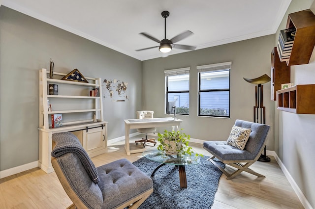 living area with ceiling fan, ornamental molding, and light hardwood / wood-style flooring