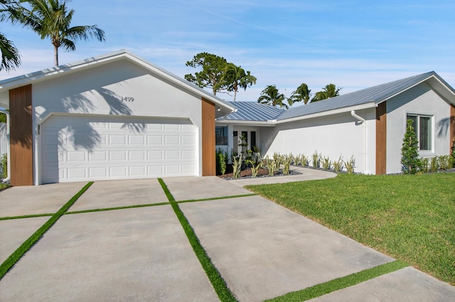 ranch-style house featuring a garage and a front yard