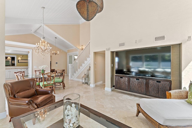 tiled living room featuring lofted ceiling with beams and a chandelier