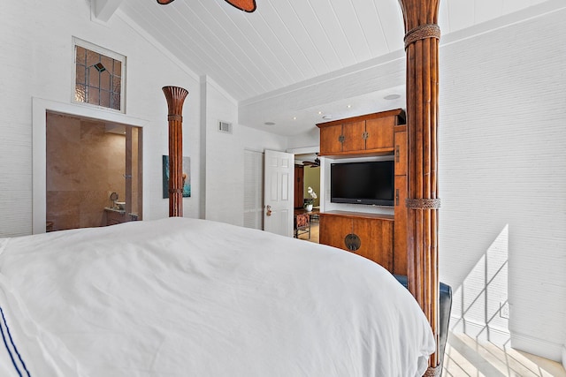 bedroom featuring lofted ceiling with beams