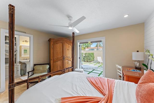 bedroom with ceiling fan, access to outside, a textured ceiling, and ensuite bath