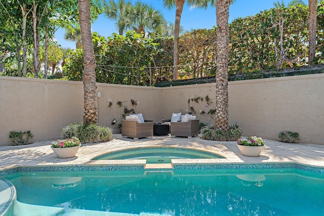 view of swimming pool with an in ground hot tub and outdoor lounge area