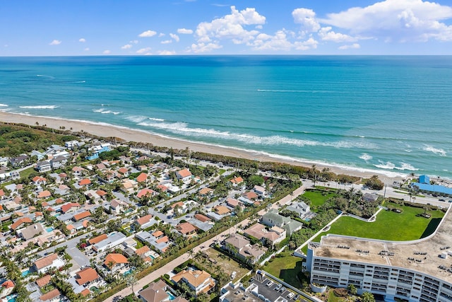 aerial view featuring a water view and a view of the beach