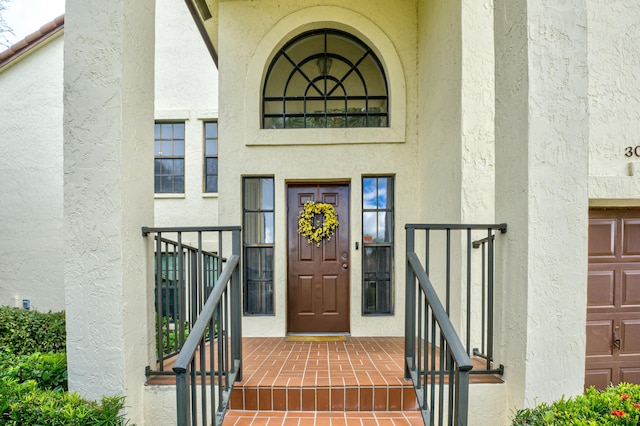 doorway to property featuring a garage