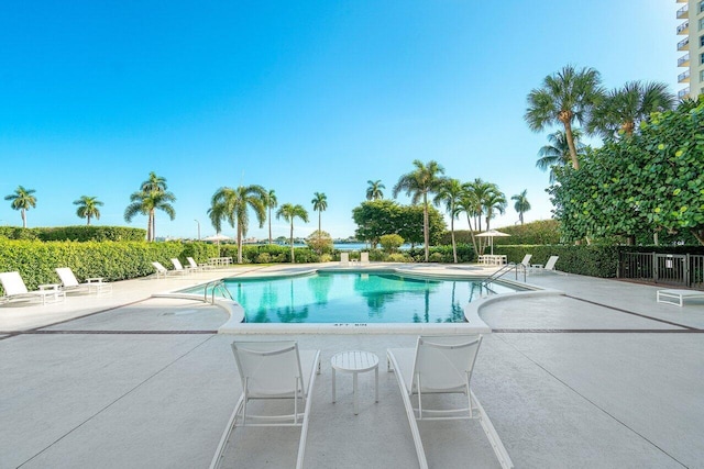 view of swimming pool featuring a patio area