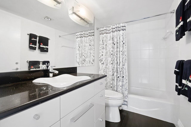 full bathroom featuring vanity, hardwood / wood-style floors, toilet, and shower / bath combo with shower curtain