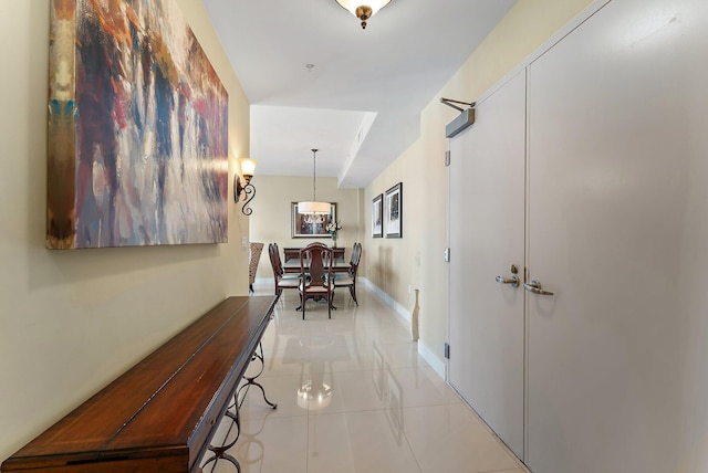 155 Ocean Ave Unit 603, Palm Beach Shores, FL 33404 - hall featuring light tile patterned floors and baseboards