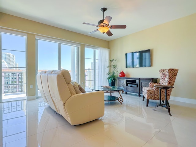 155 Ocean Ave Unit 603, Palm Beach Shores, FL 33404 - living room with healthy amount of natural light, light tile patterned floors, and ceiling fan