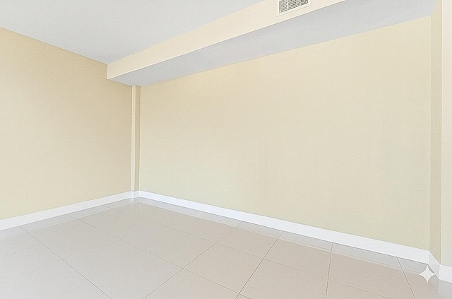 155 Ocean Ave Unit 603, Palm Beach Shores, FL 33404 - unfurnished room featuring light tile patterned flooring and baseboards