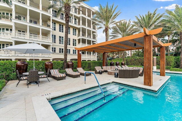 view of swimming pool featuring an outdoor hangout area, a pergola, and a patio