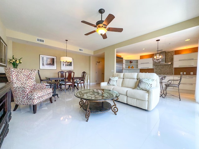 155 Ocean Ave Unit 603, Palm Beach Shores, FL 33404 - living room featuring a ceiling fan and tile patterned flooring