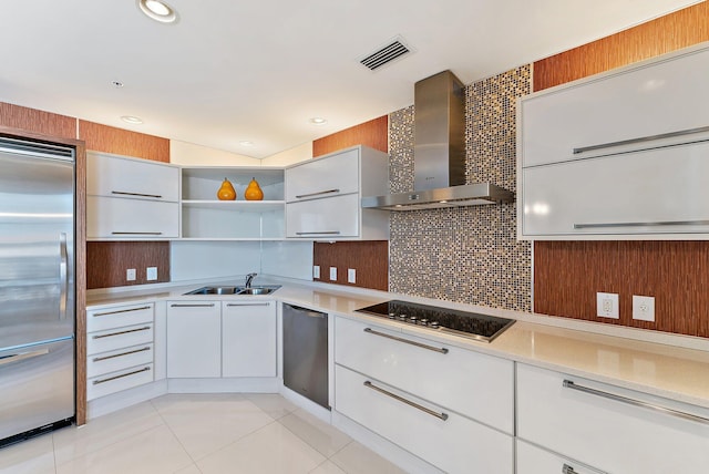 155 Ocean Ave Unit 603, Palm Beach Shores, FL 33404 - kitchen with stainless steel appliances, wall chimney range hood, a sink, open shelves, and light countertops