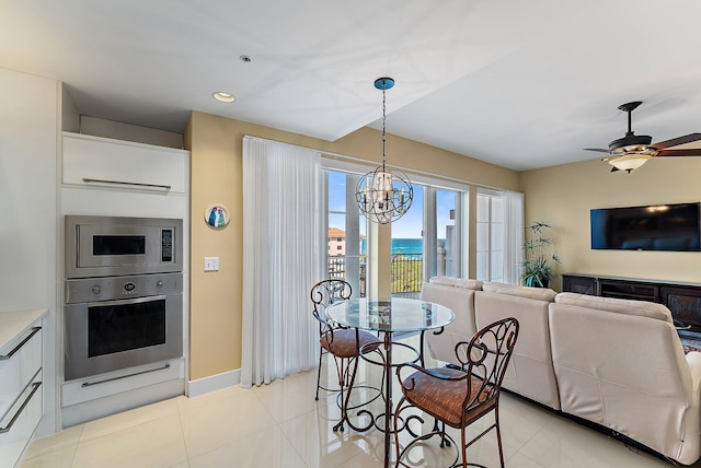 155 Ocean Ave Unit 603, Palm Beach Shores, FL 33404 - dining space featuring a chandelier, light tile patterned floors, a ceiling fan, recessed lighting, and baseboards