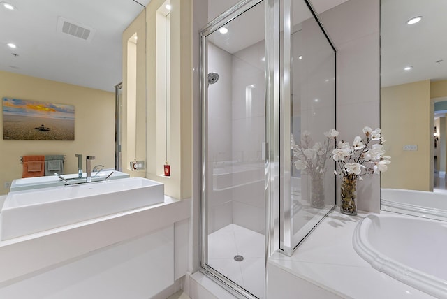 full bathroom featuring a shower stall, vanity, visible vents, and recessed lighting