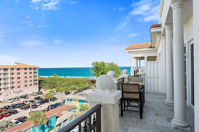 balcony featuring a water view