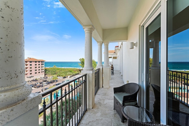 balcony featuring a water view