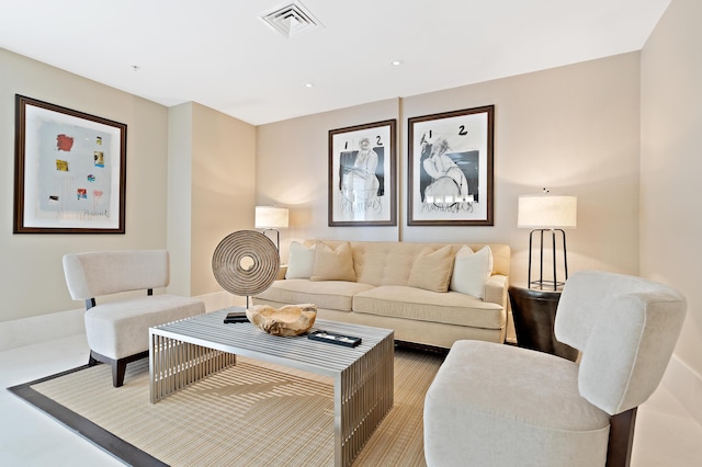 living area with recessed lighting and visible vents