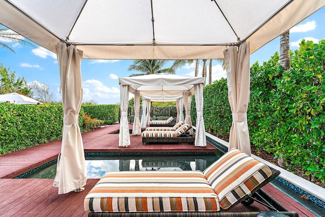view of patio / terrace featuring a gazebo and a wooden deck