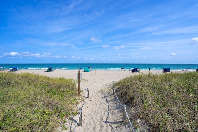 property view of water featuring a beach view