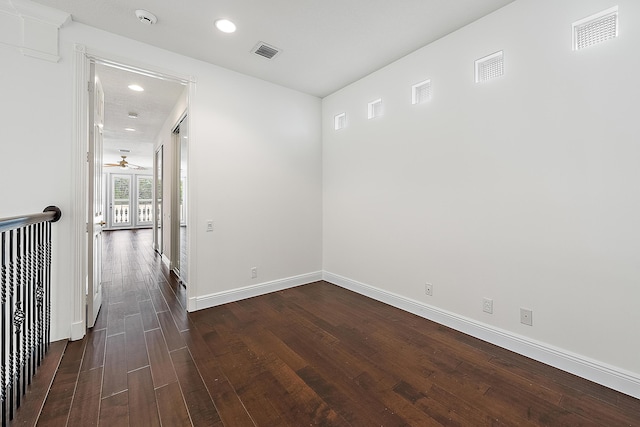 hall with recessed lighting, visible vents, dark wood finished floors, and baseboards