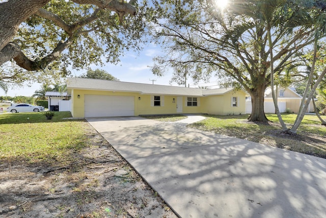 single story home featuring a front yard and a garage