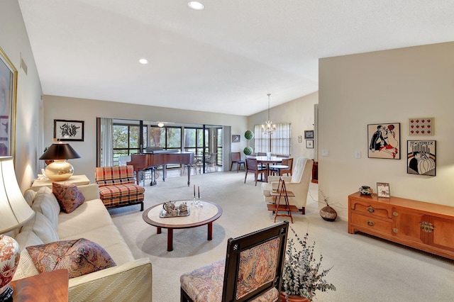 living room featuring lofted ceiling, light carpet, and a chandelier