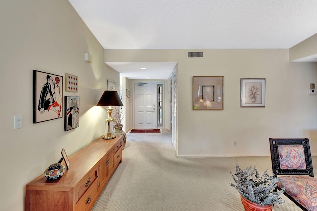 corridor with light colored carpet