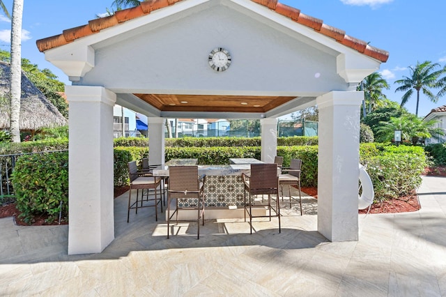 view of patio with a gazebo and exterior bar