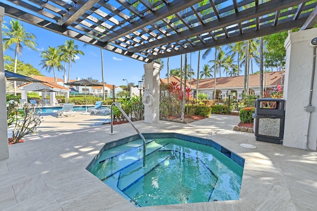 view of swimming pool featuring a pergola, a patio area, and a hot tub