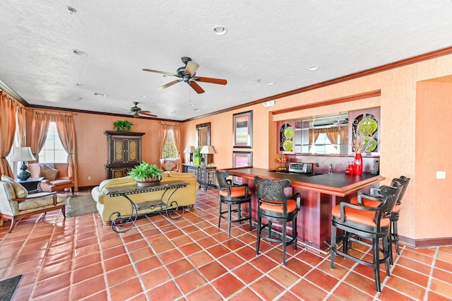 interior space featuring an outdoor bar and ceiling fan