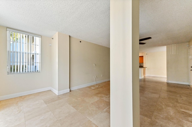 empty room featuring a textured ceiling