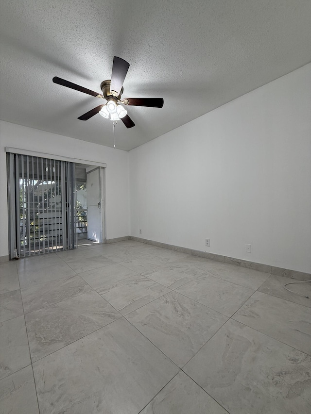 spare room with a textured ceiling