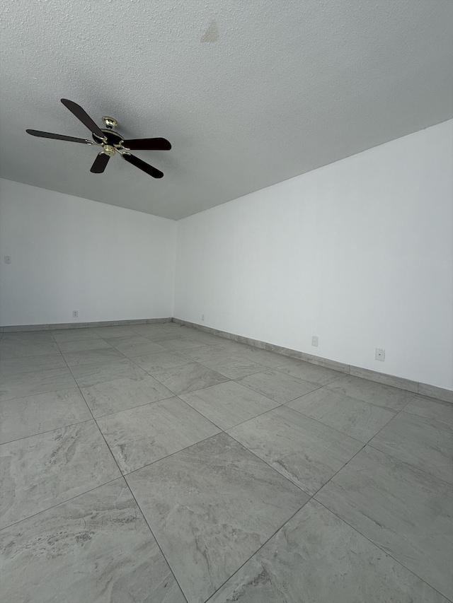 empty room with a textured ceiling