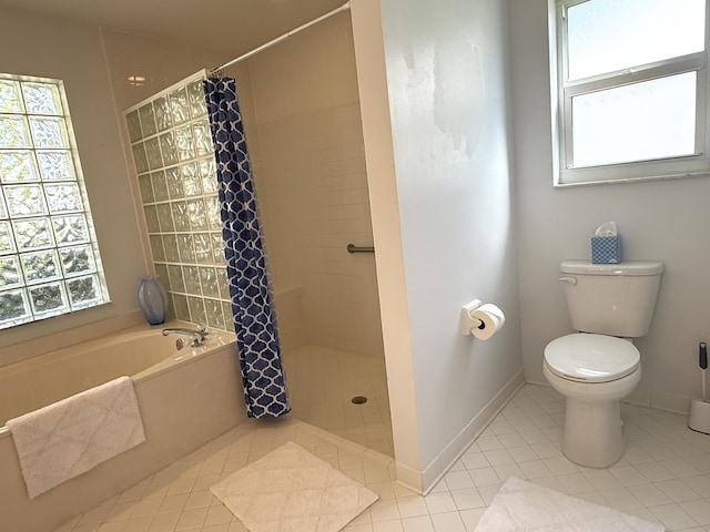 bathroom featuring toilet, shower with separate bathtub, and tile patterned flooring