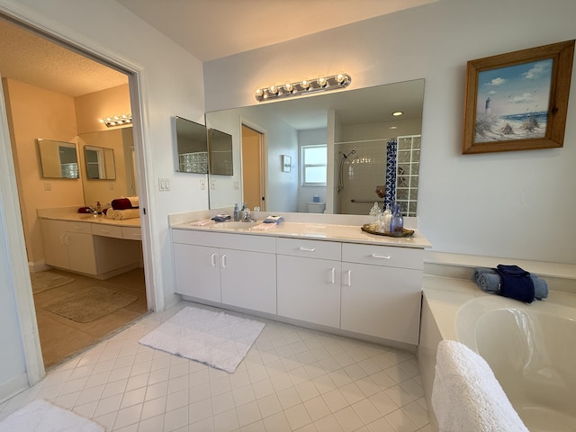 bathroom with vanity, tile patterned flooring, and separate shower and tub