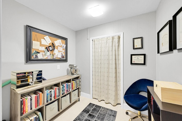 office featuring light tile patterned floors and baseboards