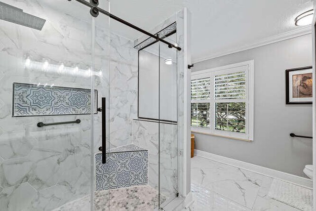 hall with light tile patterned floors and ornamental molding