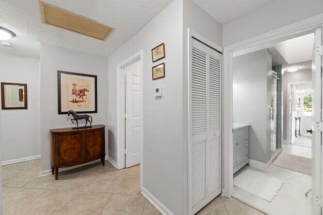 corridor with a textured ceiling