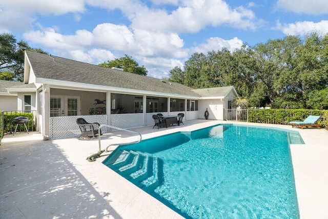 view of pool with ceiling fan and a patio area