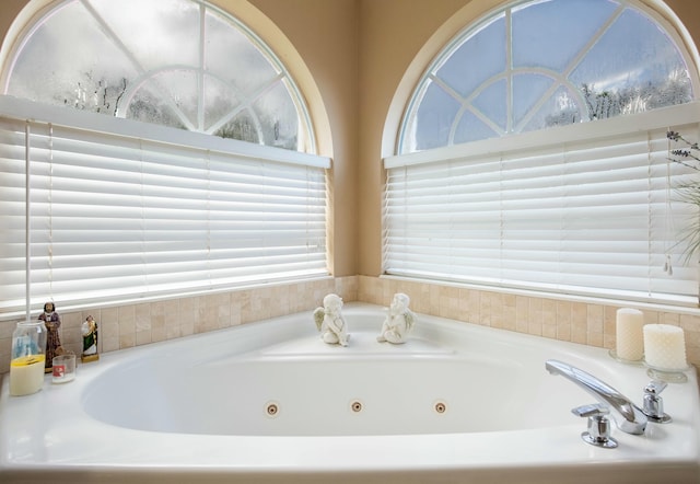 bathroom featuring a tub to relax in