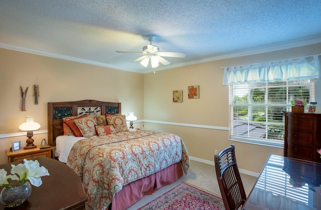 bedroom featuring ornamental molding, light carpet, ceiling fan, and a textured ceiling