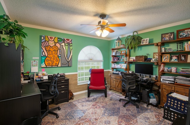 carpeted home office featuring ornamental molding and a textured ceiling