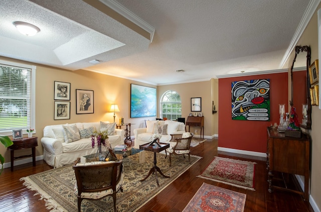 living room with ornamental molding, dark hardwood / wood-style floors, and a textured ceiling