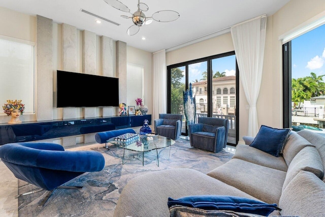 living area with visible vents and recessed lighting