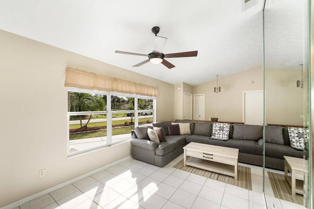 living room featuring lofted ceiling, light tile patterned floors, and ceiling fan