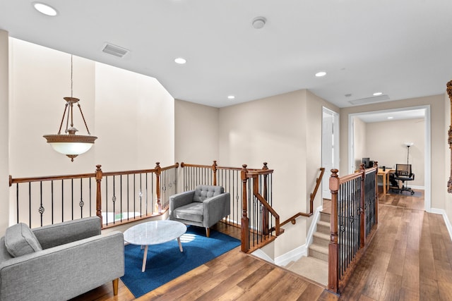 living area with hardwood / wood-style floors