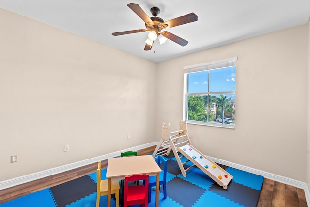 game room featuring hardwood / wood-style floors and ceiling fan