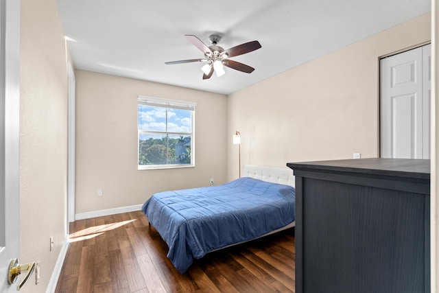 bedroom featuring ceiling fan and dark hardwood / wood-style flooring