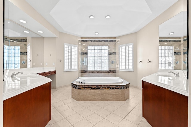 bathroom featuring tile patterned floors, separate shower and tub, and vanity